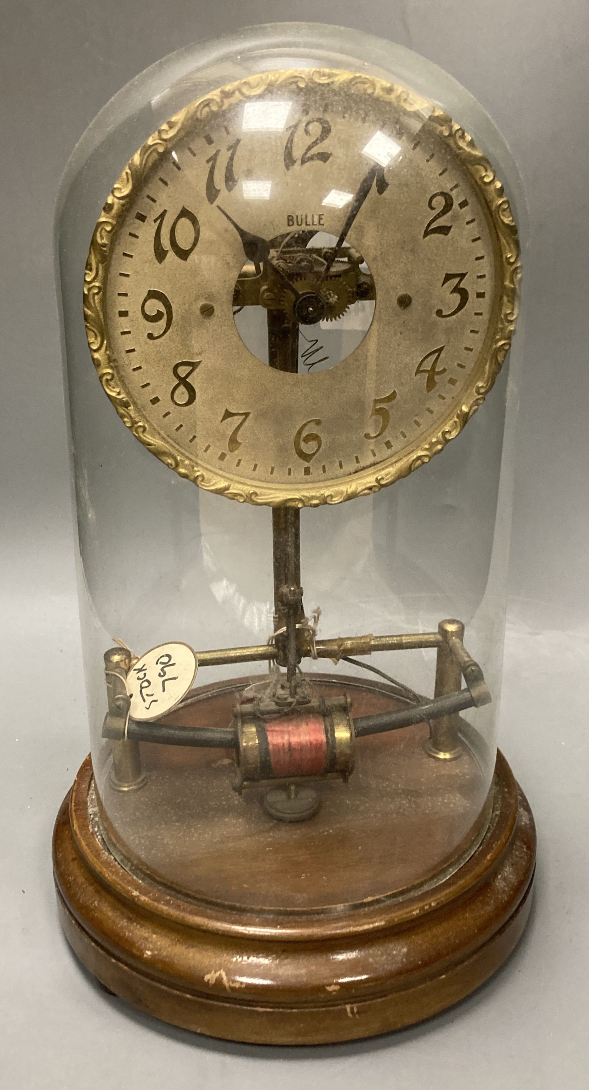 A Bulle skeleton electric mantel clock, under a glass dome, height 38cm